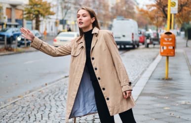 woman watiing for taxi servcie to dia airport in Northglenn, CO 